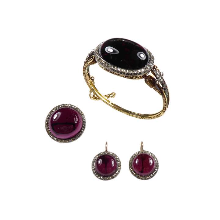 Cabochon pyrope garnet and rose cut diamond cluster set comprising bangle, brooch and pair of earrings